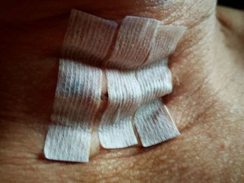Close-up of human hand on wooden table