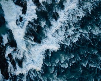 Full frame shot of rock formation in sea during winter