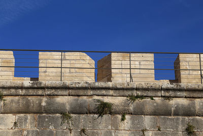 Low angle view of historical building against blue sky