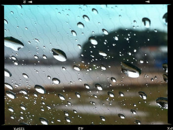 Full frame shot of raindrops on glass window
