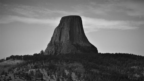 Low angle view of rock formations against sky