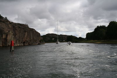 Scenic view of sea against cloudy sky