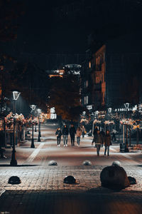 People on street at night