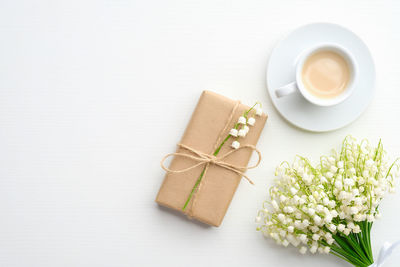 High angle view of coffee on table against white background