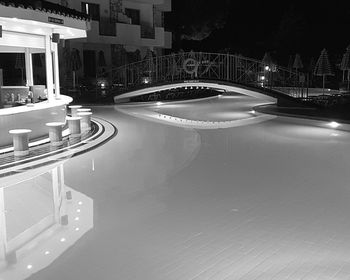 Illuminated road in city at night