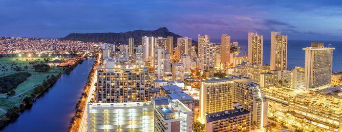 High angle view of illuminated buildings in city against sky