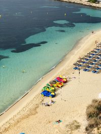 High angle view of people relaxing on beach