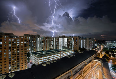 High angle view of illuminated buildings in city at night