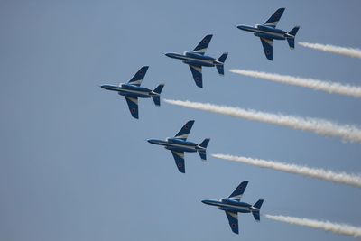 Low angle view of airplane flying in sky