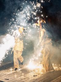 People dancing on stage at night