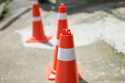 Close-up of traffic cones on road