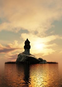 Tower on rock in sea against cloudy sky during sunset