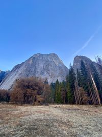 Scenic view of landscape and mountains against clear blue sky yosemite 