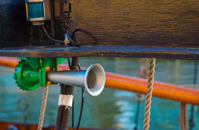 Close-up of megaphone tied on boat