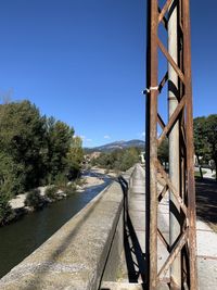 View of bridge against clear blue sky