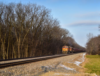 Train on railroad track against sky