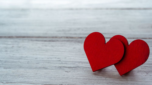 Close-up of red heart shape on table