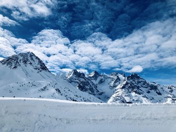 Scenic view of snowcapped mountains against sky