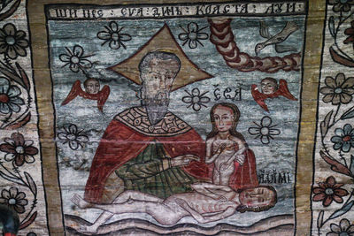 Low angle view of mural on wall in temple