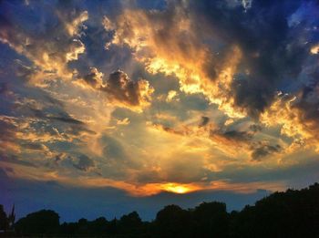 Low angle view of cloudy sky at sunset