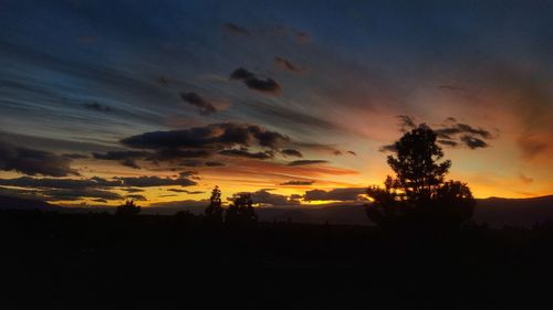 Scenic view of silhouette trees against sky during sunset