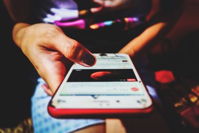 Close-up of man using mobile phone