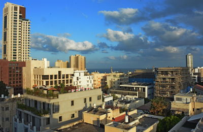 High angle view of buildings in city against sky