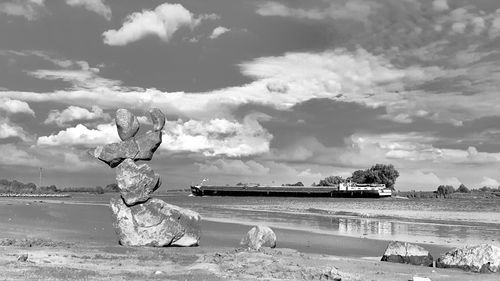 Scenic view of sea against cloudy sky