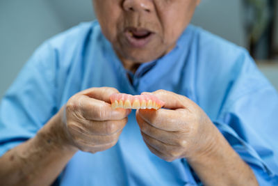 Close-up of man holding hands