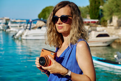 Young woman holding mobile phone