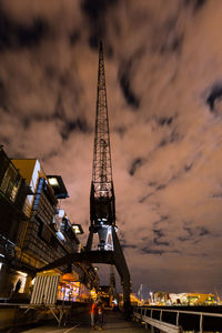 Low angle view of ferris wheel in city