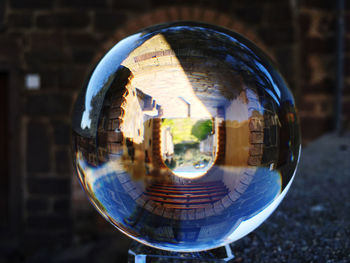 Close-up of crystal ball on glass