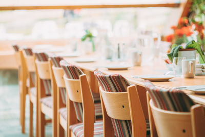 Empty chairs and tables in restaurant