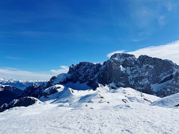 White snow against blue sky