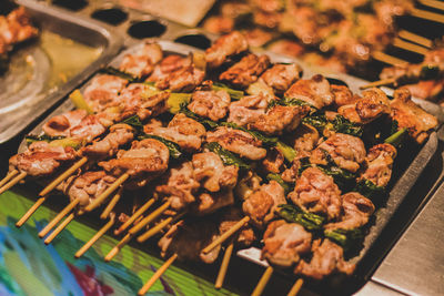 Close-up of grilled meat on skewers