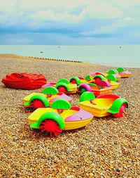 Scenic view of beach against cloudy sky