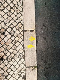 High angle view of arrow sign on road