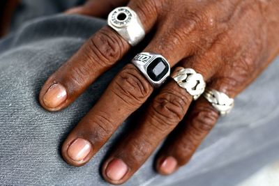 Cropped hand wearing rings