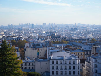 High angle view of buildings in city against sky