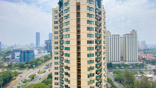 Modern buildings in city against sky