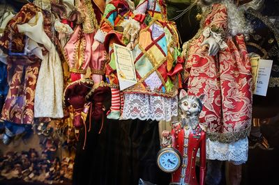 Clothes hanging for sale at market stall