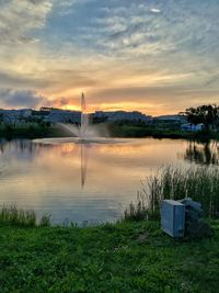 Scenic view of lake against sky during sunset