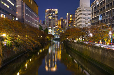 Illuminated buildings in city at night