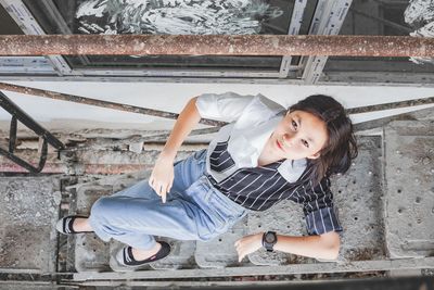 Portrait of smiling woman sitting outdoors