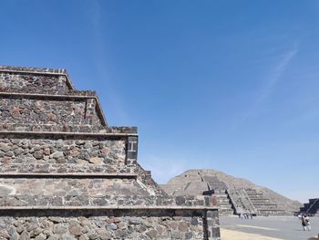 Low angle view of historical building against blue sky