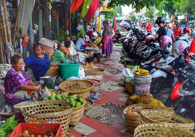 People at market stall