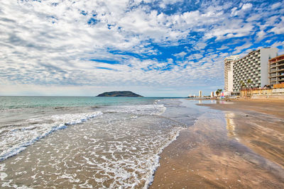 Scenic view of beach against sky