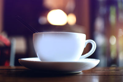 Close-up of coffee cup on table