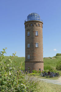 Low angle view of tower against clear blue sky