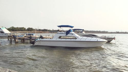 Boat in sea against clear sky